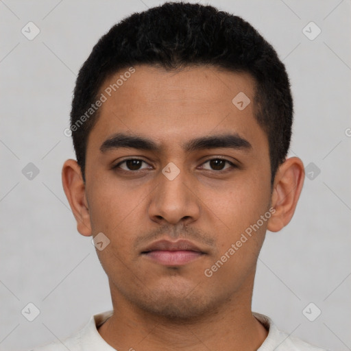 Neutral latino young-adult male with short  black hair and brown eyes