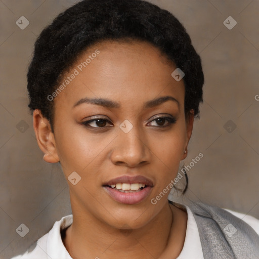 Joyful black young-adult female with short  black hair and brown eyes