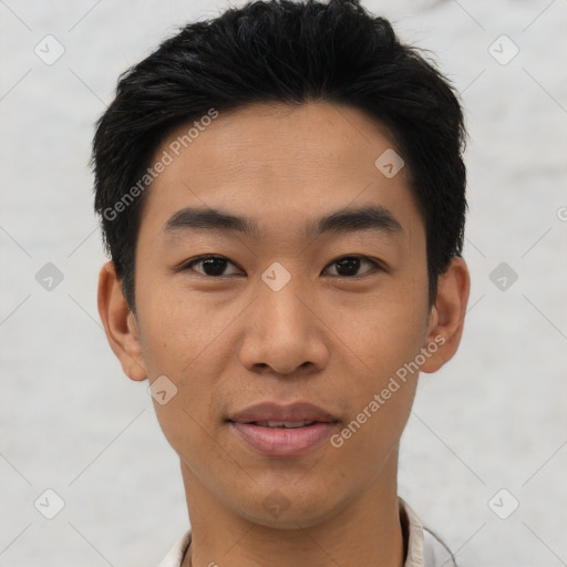 Joyful asian young-adult male with short  black hair and brown eyes