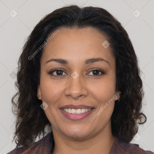 Joyful latino adult female with long  brown hair and brown eyes