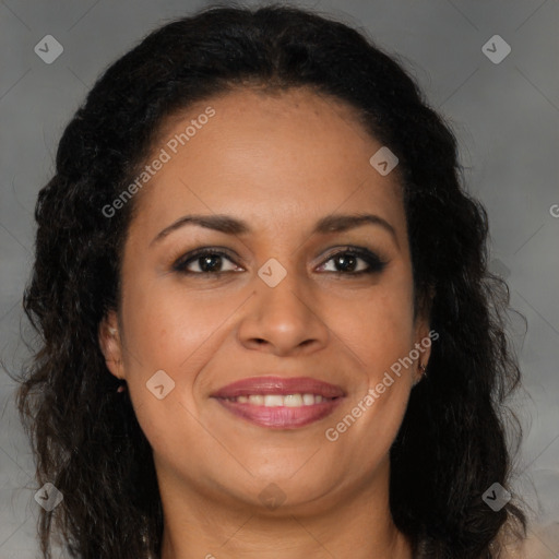 Joyful black young-adult female with long  brown hair and brown eyes