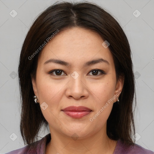 Joyful latino young-adult female with medium  brown hair and brown eyes