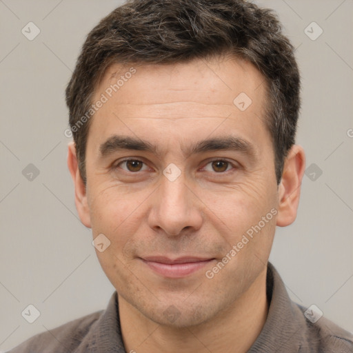 Joyful white adult male with short  brown hair and brown eyes