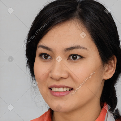 Joyful asian young-adult female with medium  black hair and brown eyes