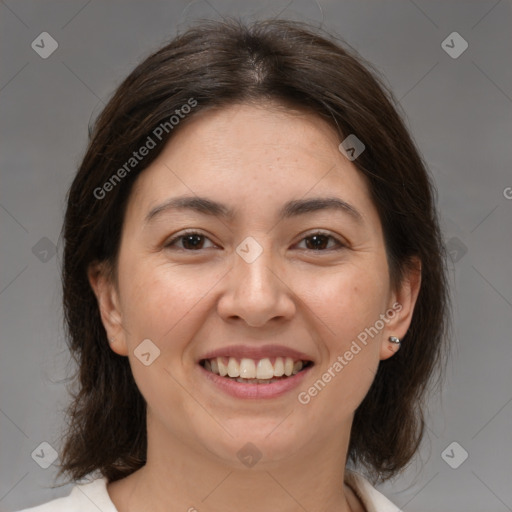 Joyful white adult female with medium  brown hair and brown eyes