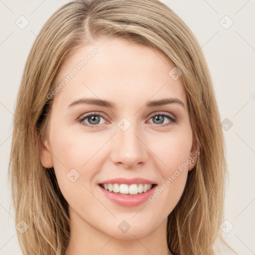 Joyful white young-adult female with long  brown hair and green eyes