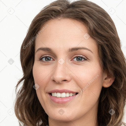 Joyful white young-adult female with long  brown hair and grey eyes