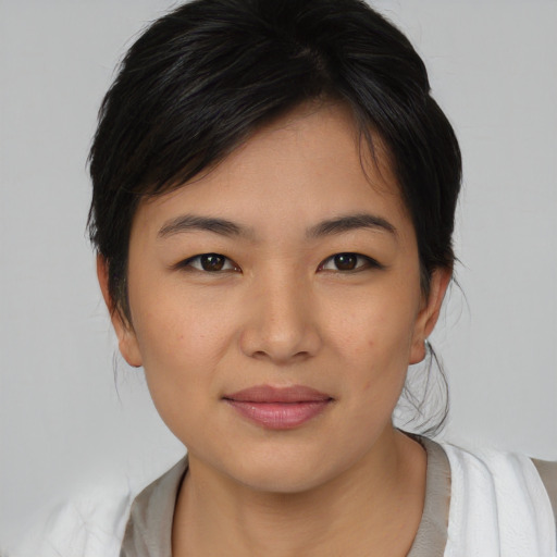 Joyful white young-adult female with medium  black hair and brown eyes