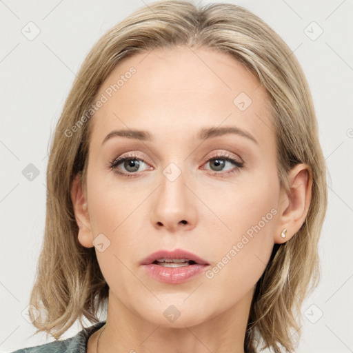 Joyful white young-adult female with medium  brown hair and blue eyes