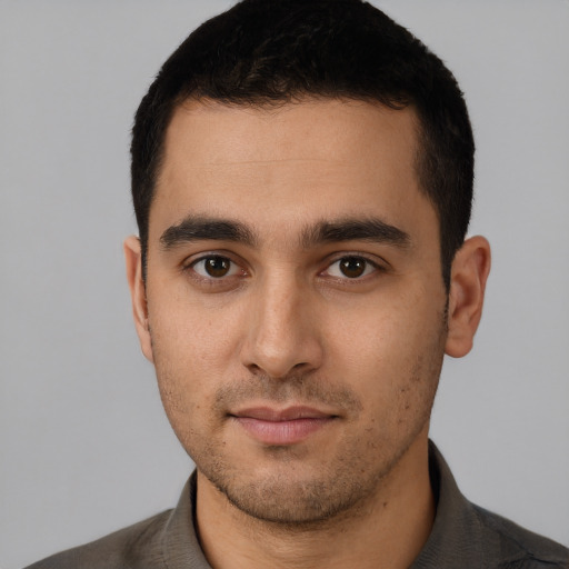 Neutral white young-adult male with short  black hair and brown eyes