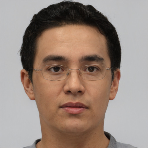 Neutral asian adult male with short  brown hair and brown eyes