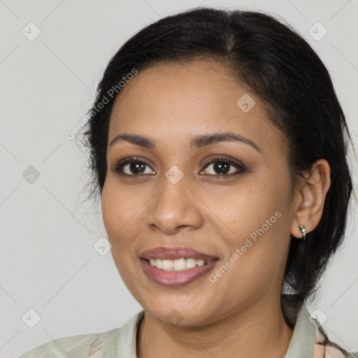 Joyful latino young-adult female with medium  black hair and brown eyes