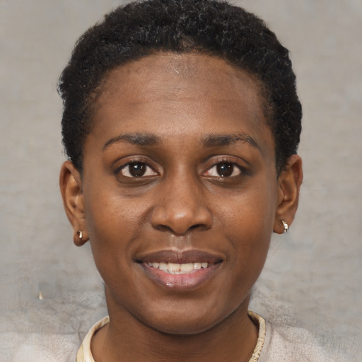 Joyful black young-adult female with short  brown hair and brown eyes