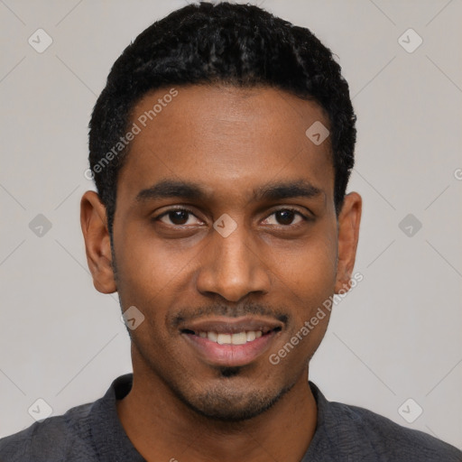 Joyful black young-adult male with short  black hair and brown eyes