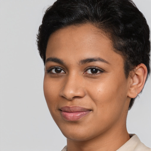 Joyful latino young-adult female with short  brown hair and brown eyes