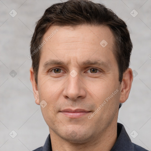 Joyful white adult male with short  brown hair and brown eyes