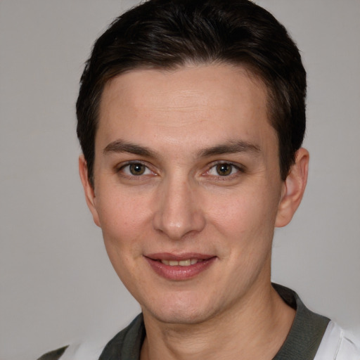 Joyful white young-adult male with short  brown hair and brown eyes