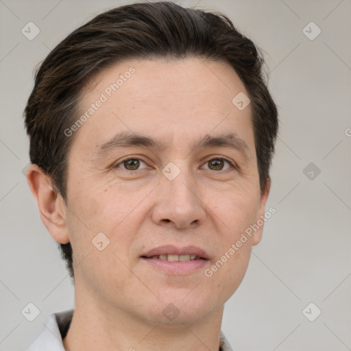 Joyful white adult male with short  brown hair and brown eyes