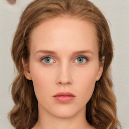 Neutral white young-adult female with long  brown hair and green eyes