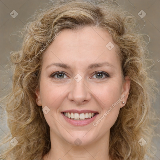 Joyful white young-adult female with medium  brown hair and green eyes