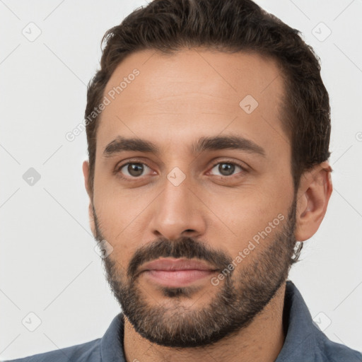 Neutral white young-adult male with short  brown hair and brown eyes