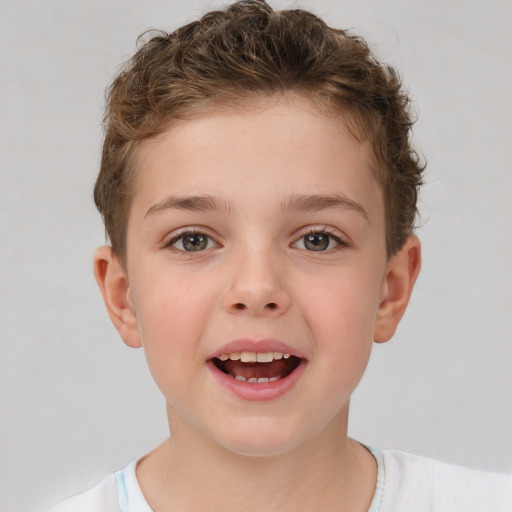 Joyful white child male with short  brown hair and brown eyes