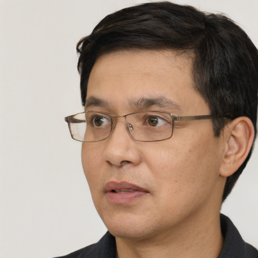Neutral white adult male with short  black hair and brown eyes
