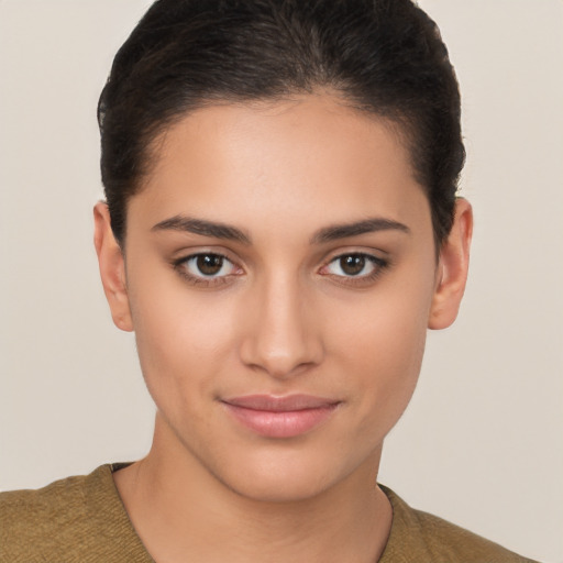 Joyful latino young-adult female with short  brown hair and brown eyes