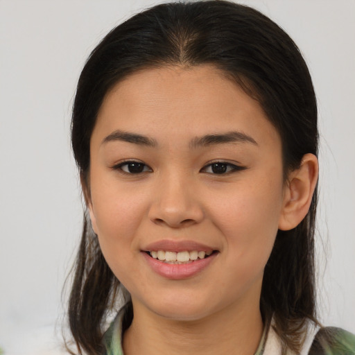 Joyful asian young-adult female with medium  brown hair and brown eyes