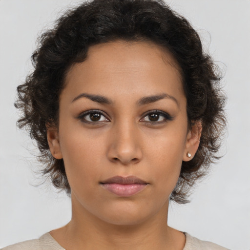Neutral latino young-adult female with medium  brown hair and brown eyes