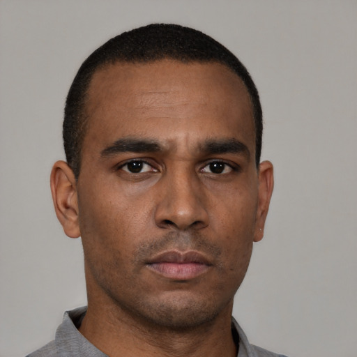 Neutral latino young-adult male with short  brown hair and brown eyes