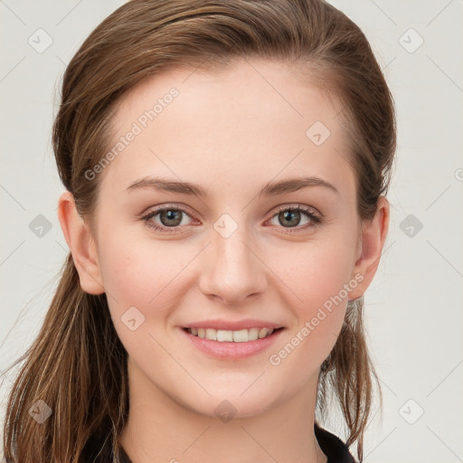 Joyful white young-adult female with long  brown hair and blue eyes