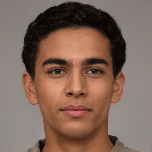 Neutral latino young-adult male with short  brown hair and brown eyes