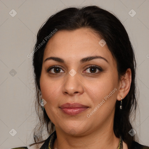 Joyful latino young-adult female with medium  brown hair and brown eyes