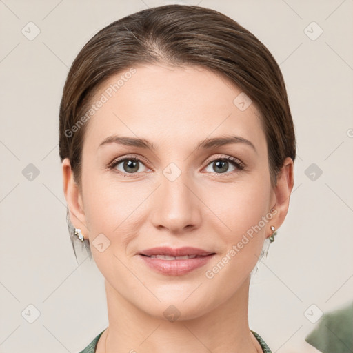 Joyful white young-adult female with short  brown hair and grey eyes