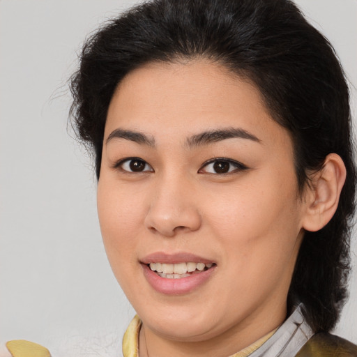 Joyful asian young-adult female with medium  brown hair and brown eyes