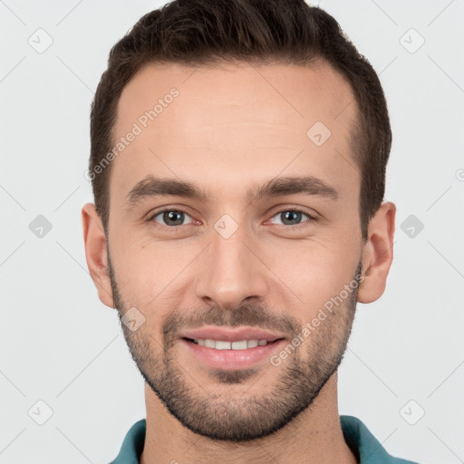 Joyful white young-adult male with short  brown hair and brown eyes