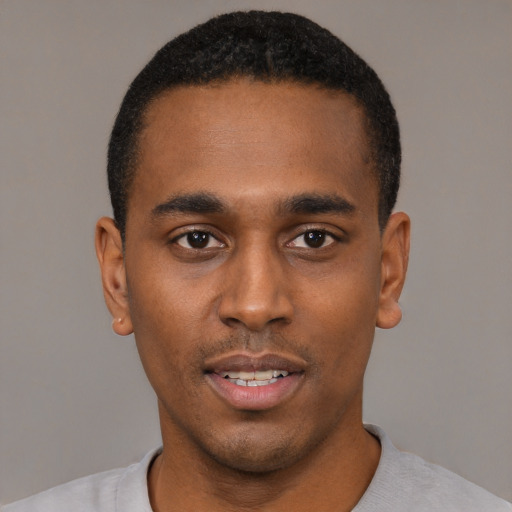 Neutral black young-adult male with short  black hair and brown eyes
