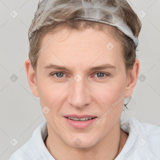 Joyful white adult female with short  brown hair and grey eyes