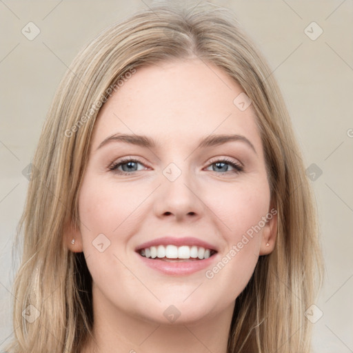 Joyful white young-adult female with long  brown hair and grey eyes