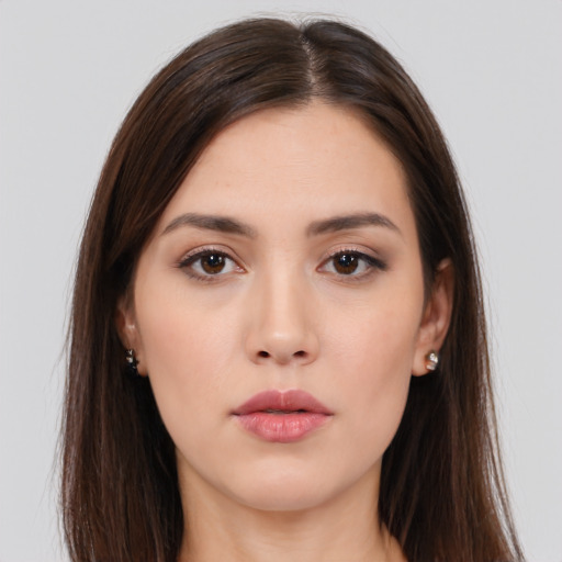 Neutral white young-adult female with long  brown hair and brown eyes
