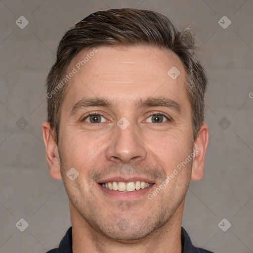 Joyful white adult male with short  brown hair and brown eyes