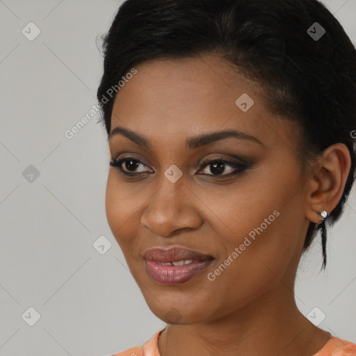 Joyful black young-adult female with medium  black hair and brown eyes