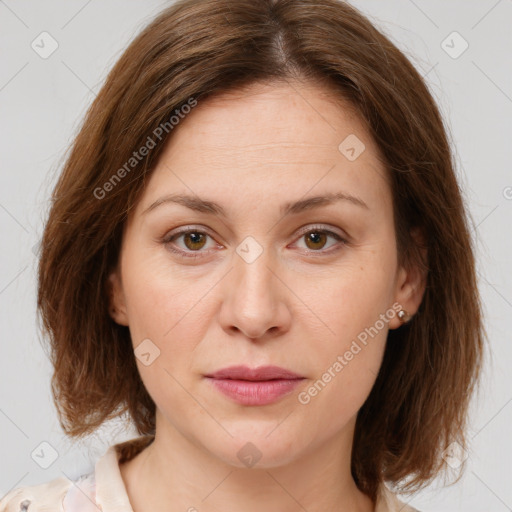 Joyful white young-adult female with medium  brown hair and green eyes