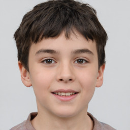 Joyful white child male with short  brown hair and brown eyes