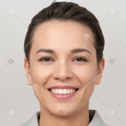 Joyful white young-adult female with short  brown hair and brown eyes