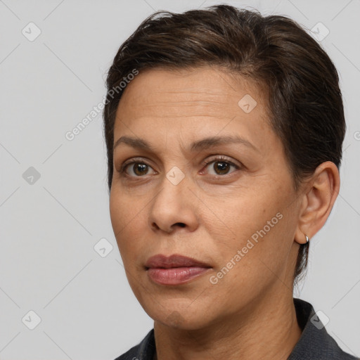 Joyful white adult female with short  brown hair and brown eyes