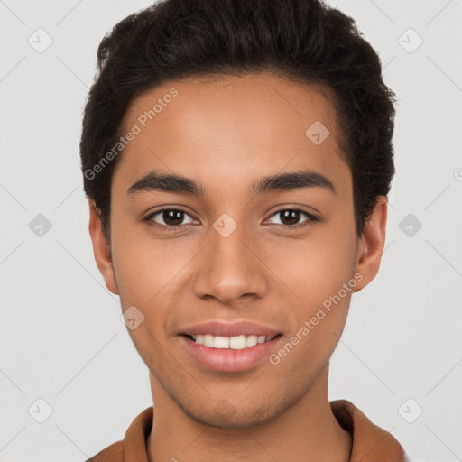 Joyful latino young-adult male with short  brown hair and brown eyes