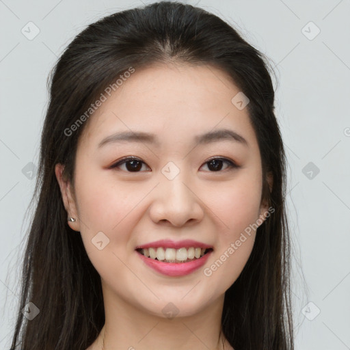 Joyful asian young-adult female with long  brown hair and brown eyes