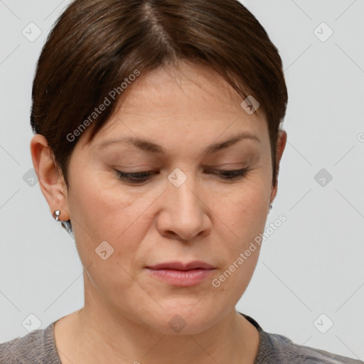 Joyful white adult female with short  brown hair and brown eyes